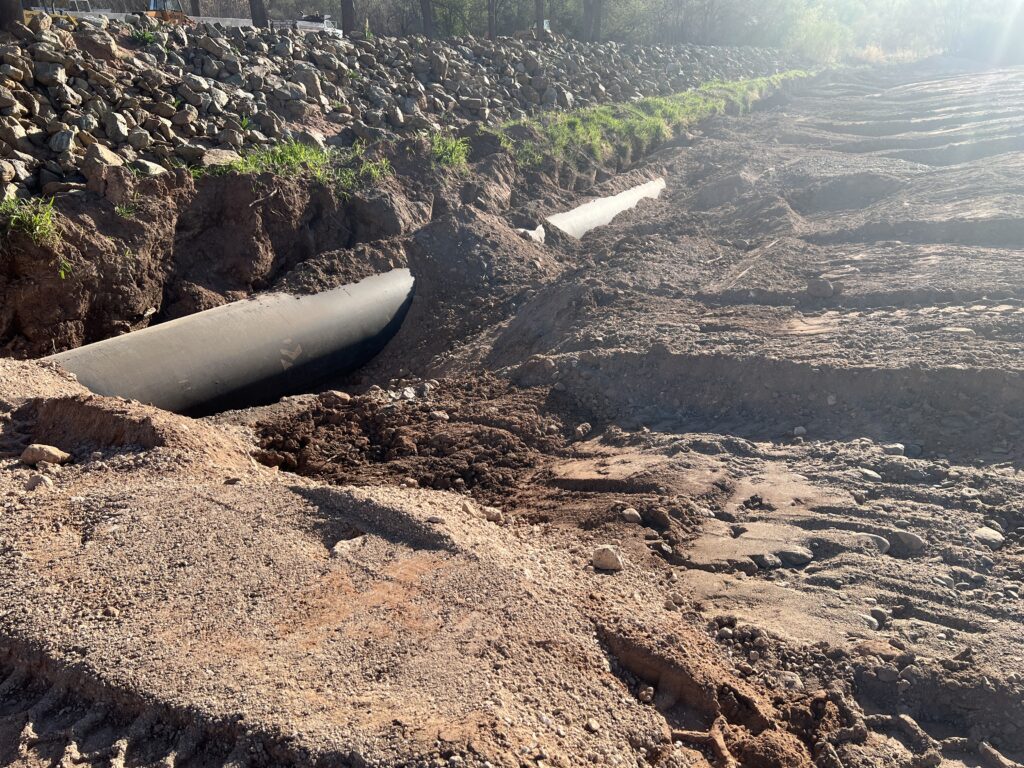 Section of pipe being buried