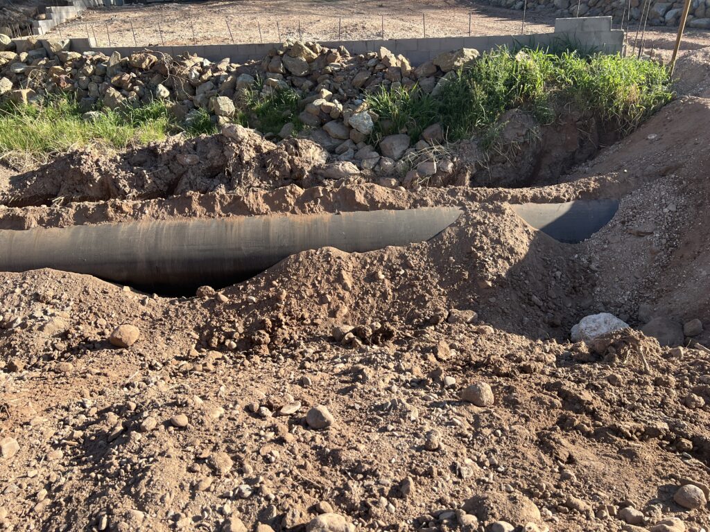 Section of pipe being buried