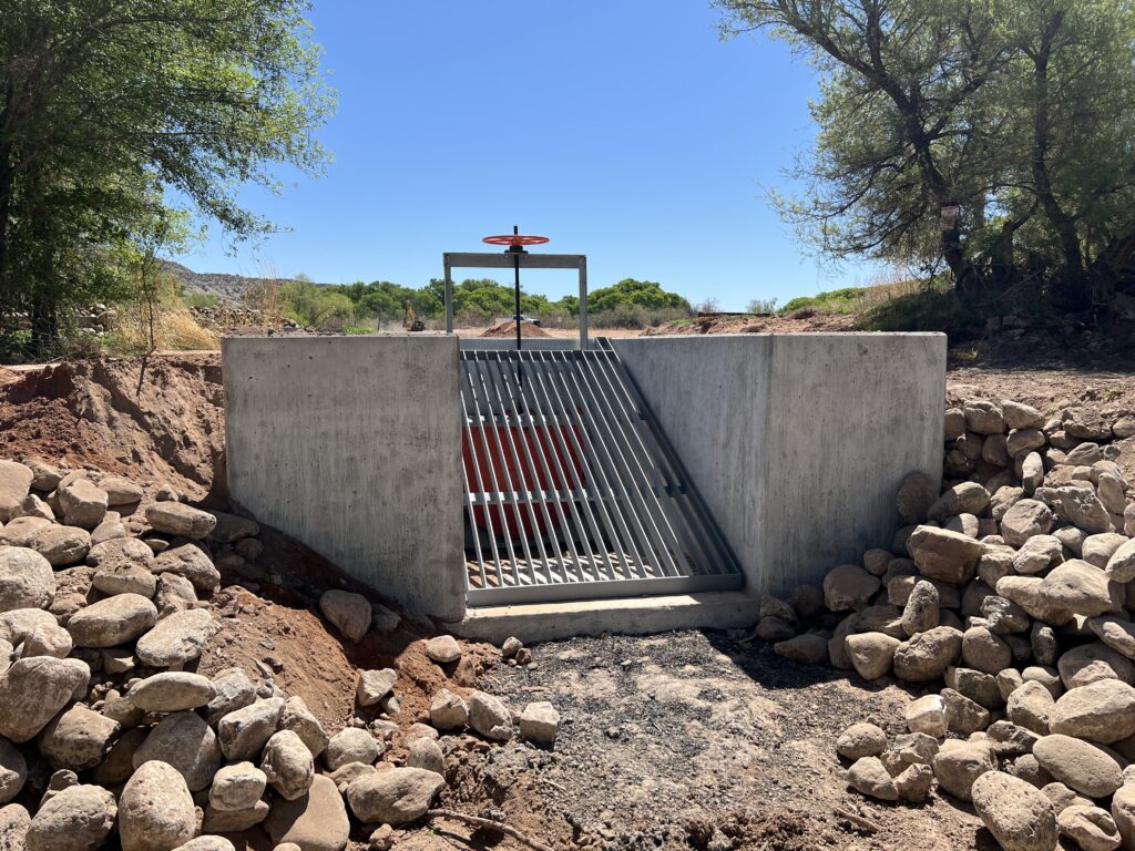 Inlet headwall, bar grate, and 48" round head gate